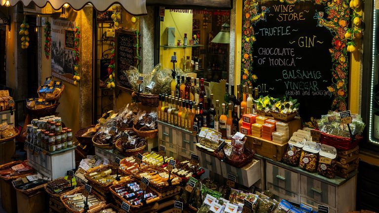 A large variety of goods on display outside an Italian delicatessen