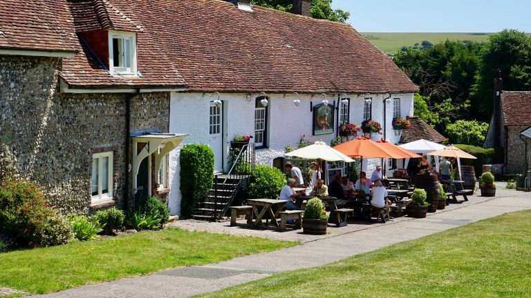 Whitewashed country pub on a sunny summer day